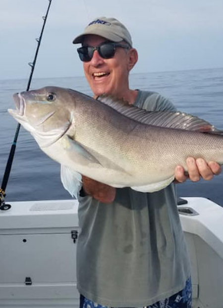 Happy angler holding up big Oregon Inlet Tilefish
