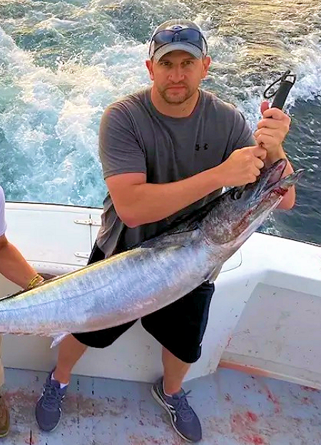 Young man caught huge wahoo.